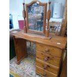 A pine dressing table with a vanity mirror.