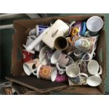 A box of cups with a kettle