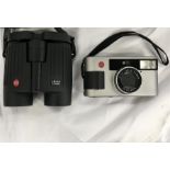 A selection of cameras, binoculars and lenses; including: Leica 8x32 BN binoculars, Leica camera,