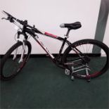 A Merida mountain bike. 27 speed with remotely adjustable front suspension, hydraulic disc brakes.