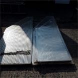 Five angle cut polycarbonate sheets.