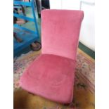 A pink bedroom chair.