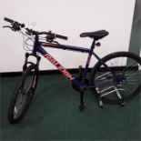 A Raleigh mountain bike. 21 speed with front suspension and mechanical disc brakes. In good