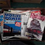 A box of locomotive magazines together with a box containing Warship fact folders.