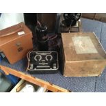 An assortment of vintage electricals. Includes a bed warmer, photo timer and volt readers.