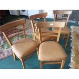 A set of four kitchen chairs.