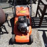 A Flymo petrol mower.