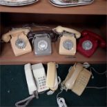 Four retro telephones together with three others.