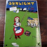 An enamel metal sign depicting Sunlight Soap.