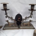 A collection of brass and copper items to include a kettle and a pair of candlesticks depicting