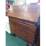 A three drawer oak bureau.