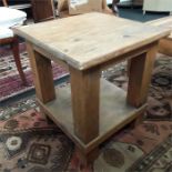 A pine two tier side coffee table.