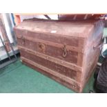 A domed top travel trunk.