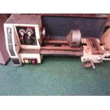 An Axminster metal working lathe with a box of ancillary.