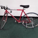 A vintage road bike. 16 speed with tri bars and clipless pedals. Corrosion throughout and signs of