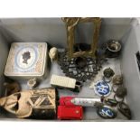 An assortment of items including brass door furniture, glass ashtrays, metal picture frame and an