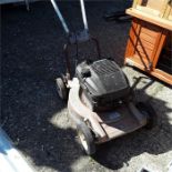 A petrol mower.