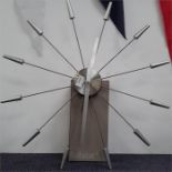 A Habitat Spoke metal wall hanging clock.