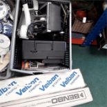 A box containing a projector etc together with a Benbo monopod tripod and a Velbon tripod.