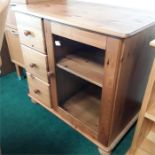 A pine three drawer cabinet.