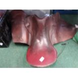 A leather horse saddle.