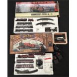 Two Hornby sets: Harry Potter Hogwarts Express with locomotive and two coaches (used, missing some