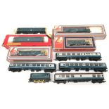 Six Hornby and Lima BR diesel locomotives, together with four Hornby/ Triang Inter City coaches.