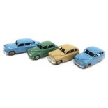 Four Dinky Toys cars: 2 x 40e /153 Standard Vanguard, one in tan, the other in blue with beige hubs;