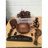 A collection of wooden items including a tribal mask.