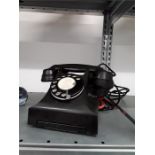 A vintage Bakelite telephone.