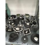 A large selection of Wedgwood jasper ware in black and green.