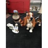 A Beswick dog figure together with other animal figures.