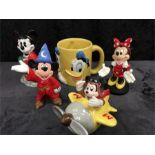 5 items: Mickey Mouse sorcerer, Mickey Mouse in toga, Minnie Mouse from Euro Disney, Schmid Disney