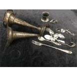 A bag of scrap silver including a napkin ring, a pair of trumpet vases, etc.