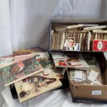 Three boxes of cigarette cards and albums.