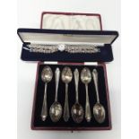 A boxed set of silver plated spoons together with two items of jewellery.