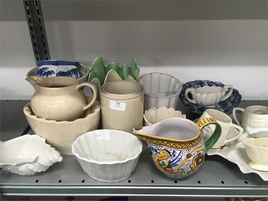 A collection of porcelain jelly moulds, a blue and white china bowl and other china.