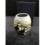 A Moorcroft ovoid vase decorated with Puffins 5.5” high, with box.