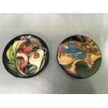 Two Moorcroft pin dishes.