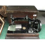 A black Sewing machine. by Wheeler & Wilson.