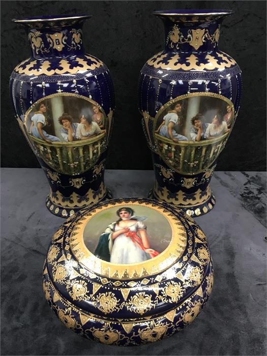 A pair of large vases of blue ground decorated with gilding together with a similarly decorated