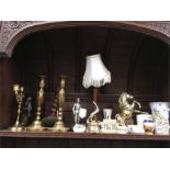 Selection of candlesticks, china and metal ornaments including lamp, golden horse, knight in armour.