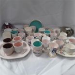 A quantity of various Poole pottery egg cups.