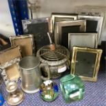 A collection of picture frames and paperweights.