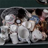 A box containing various china plates, mugs, jugs cups and saucers etc.