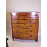 A Victorian inlaid mahogany bowfront chest of two over four drawers, raised on turned supports,