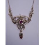 A 9ct yellow gold, ruby and seed pearl set openwork necklace pendant, 2" long