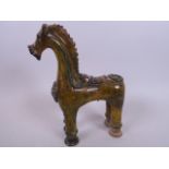 An antique Turkish Çanakkale pottery pourer modelled in the form of a horse, 8½" high