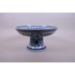 A Chinese blue and white porcelain stem bowl decorated with birds, fruit and flowers, 10"