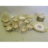 A C19th Staffordshire part tea and coffee service individually hand painted with flowers and